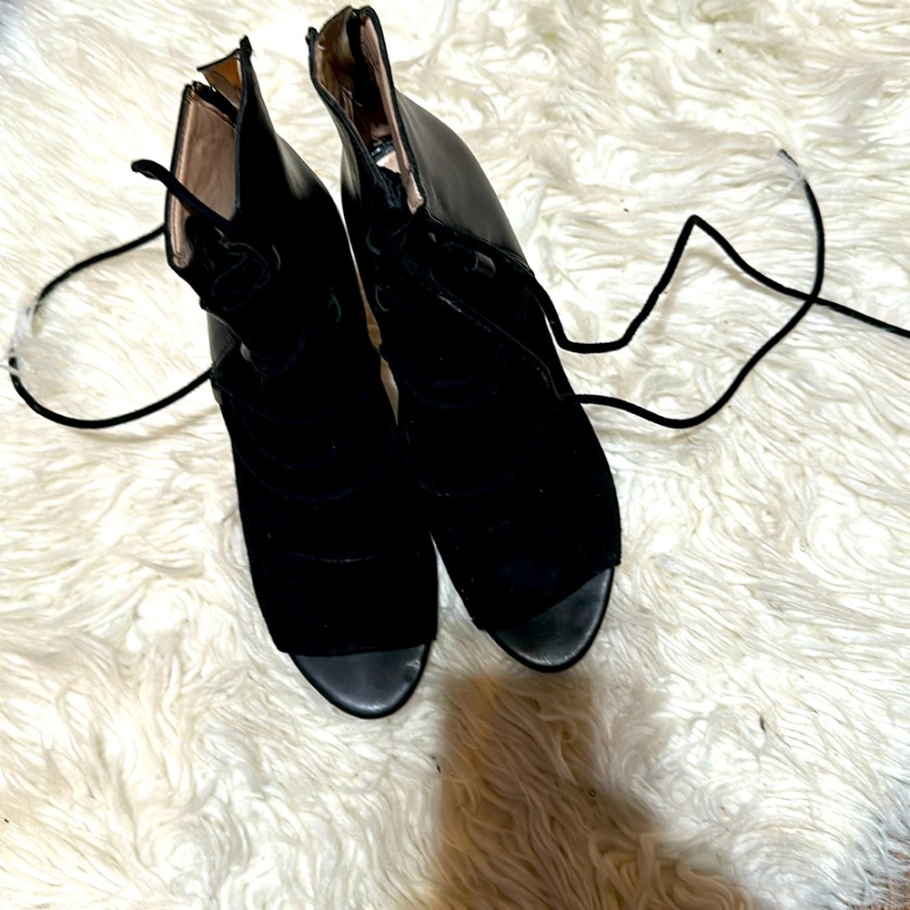 Black leather and suede lace up booties by French Connection.  Size 8.